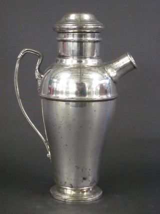 A silver plated cocktail shaker, spout cover missing,