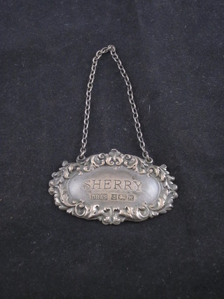 A modern silver sherry decanter label
