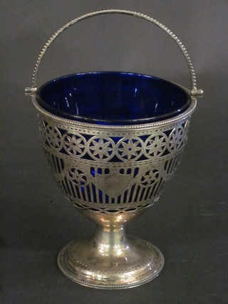 A George III pierced silver bucket shaped sugar bowl complete with blue glass liner, London 1820, 3 1/2"