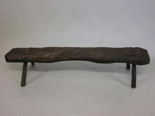 An antique rectangular rustic elm pig slaughtering bench