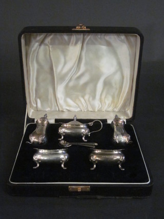 A 5 piece silver condiment set comprising pair of salts, pair of pepper pots, mustard pot, 3 condiment spoons, Birmingham 1934  with Jubilee hall mark, 5 1/2 ozs