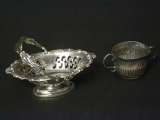 A miniature antique silver twin handled quaiche, f, together with  an Edwardian miniature pierced silver boat shaped basket with  swing handle 1909, 1 ozs