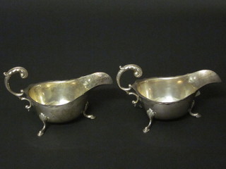 A pair of Georgian style silver sauce boats with C scroll handles, Birmingham 1933, 4 1/2 ozs