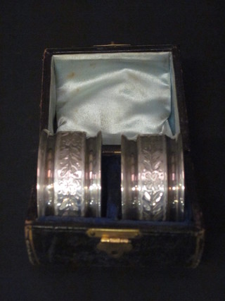 A pair of Victorian engraved silver napkin rings, London 1867, cased