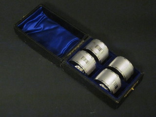 4 silver plated napkin rings, cased