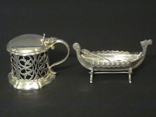 A Victorian pierced circular silver plated mustard pot complete with blue glass liner and a Continental salt in the form of a long  boat