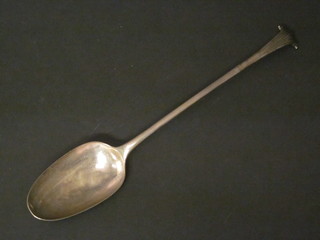 An Antique silver bottom marked serving spoon, 3 1/2 ozs