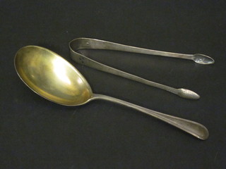 A pair of Georgian silver bright cut sugar tongs, London 1832 together with a serving spoon marked Brinks Sterling, 1 1/2 ozs