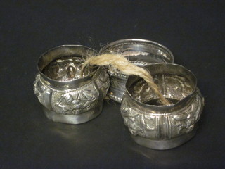 A silver napkin ring and 2 Eastern white metal napkin rings