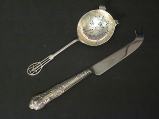 A silver tea strainer, Sheffield 1943 and a silver handled cheese knife