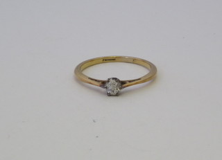 A lady's gold dress/engagement ring set a diamond