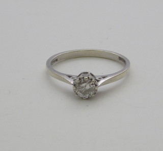 A platinum dress ring set a solitaire diamond