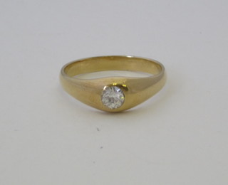 A gold gypsy ring set a diamond