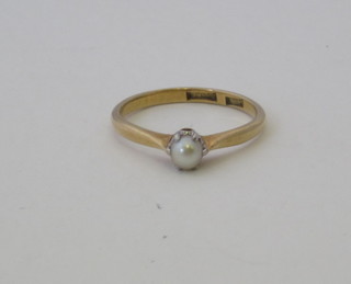 A 14ct yellow gold dress ring set a pearl