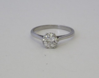 An 18ct white gold or platinum dress/engagement ring set a  solitaire diamond