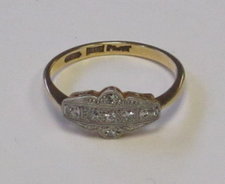 A lady's gold dress ring set illusion set diamonds
