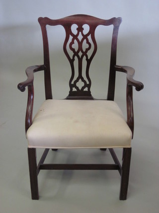 A 19th Century mahogany Chippendale style carver chair, raised  on turned supports with H framed stretcher