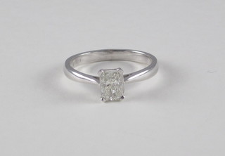 A lady's 18ct white gold dress/engagement ring set a rectangular Princess cut diamond, approx 1ct