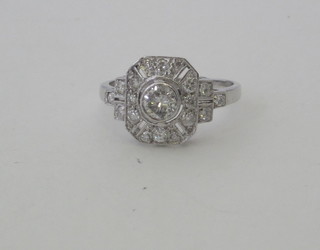 A lady's 18ct white gold dress ring set a circular diamond surrounded by numerous diamonds, approx 0.80ct