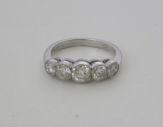 A lady's 18ct white gold dress/engagement ring set 5 round  brilliant cut diamonds, approx 1.50ct