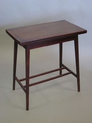 A rectangular Edwardian mahogany card table, raised on square tapering supports with H framed stretcher 27"