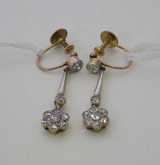 A pair of diamond drop earrings