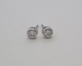 A pair of diamond ear studs, approx 0.43ct