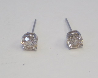 A pair of lady's diamond stud earrings, approx 1.20ct