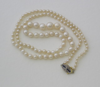 A rope of cultured pearls with 18ct gold clasp
