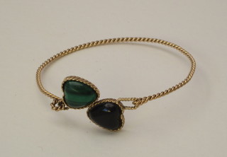 A 9ct gold bracelet set 2 cabouchon cut heart shaped stones