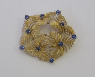 An 18ct pierced gold brooch set sapphires