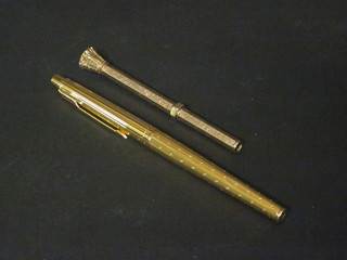 A gilt metal propelling pencil contained in a gilt metal case and a Parker pen contained in a gilt metal case