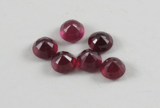 6 unmounted round cut rubies, approx 10cts