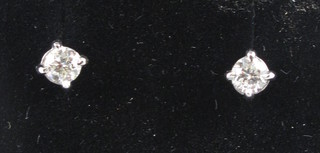 A pair of diamond, claw set ear studs, approx 0.42ct