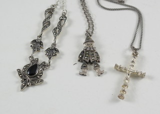 3 fine silver chains hung an articulated figure of a clown, a cross  and a pendant
