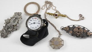 A circular gold pendant, a lady's dress watch in a silver case, 2  silver brooches etc