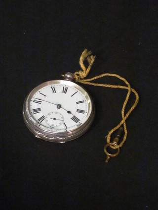 An open faced pocket watch contained in a silver case