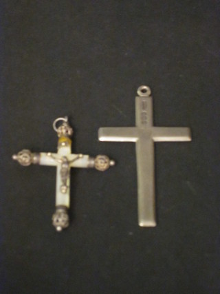 A silver cross and 1 other