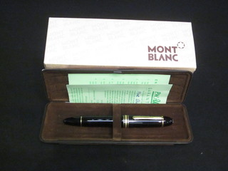 A black Mont Blanc Meisterstuck fountain pen, boxed