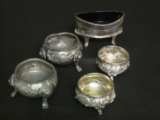 An oval silver plated salt with blue glass liners and 2 pairs of silver plated salts
