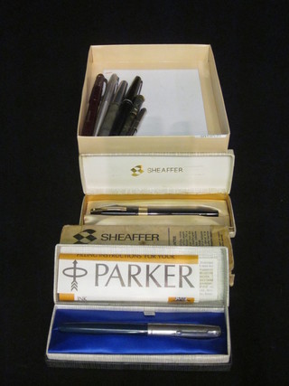A blue Parker fountain pen and other fountain pens