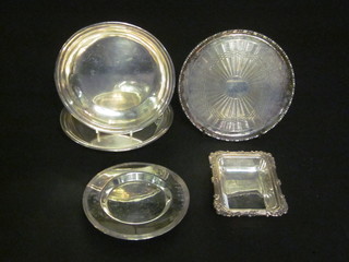A circular silver plated salver, raised on 4 bun feet 6 1/2", 2  circular silver plated dishes, a silver plated patent 5"