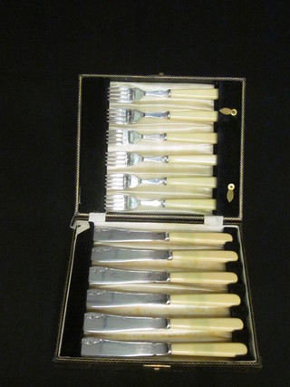 A set of 6 silver plated fish knives and forks cased