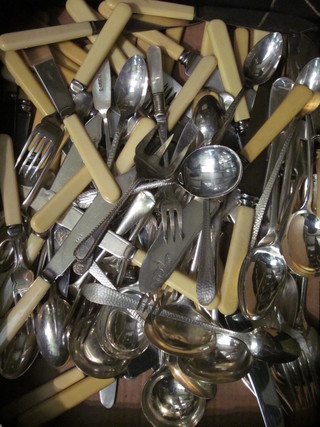 A collection of silver plated flatware