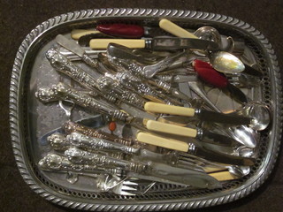 A rectangular silver plated tea tray and a collection of plated flatware