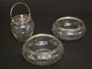 2 cut glass bowls with silver rims and a glass biscuit barrel with plated mount