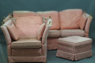 A pink Knowle 2 seat settee, together with a matching armchair  and a footstool