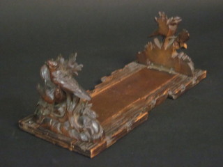 A pair of 19th Century carved German book ends decorated birds  13"