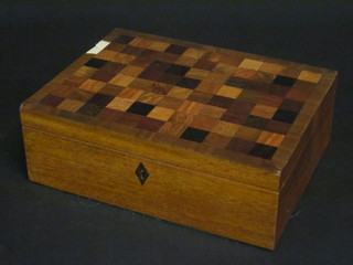 A 19th Century mahogany trinket box with hinged lid, the lid  inlaid square parquetry 12"