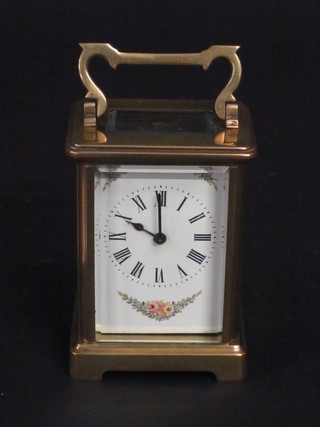 A French carriage clock with enamelled dial contained in a gilt metal case ILLUSTRATED